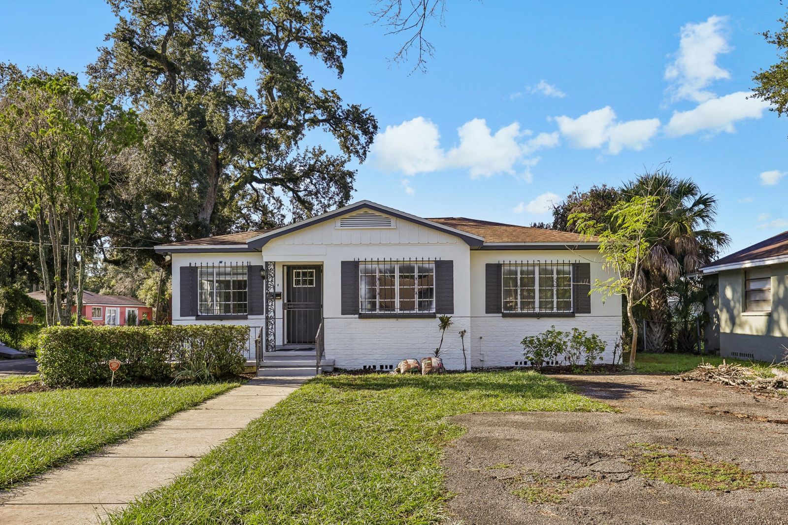 Front of 2217 Mallory Ave after exterior paint, new shutters and landscaping